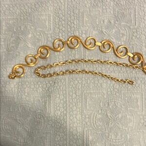 Elegant Gold-Tone Swirl Belt.